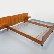 Double bed vintage modernist in teak and black metal from the 1960s with bedside tables.