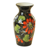 Vintage black ceramic vase with painted floral decoration – stylised colourful flowers.