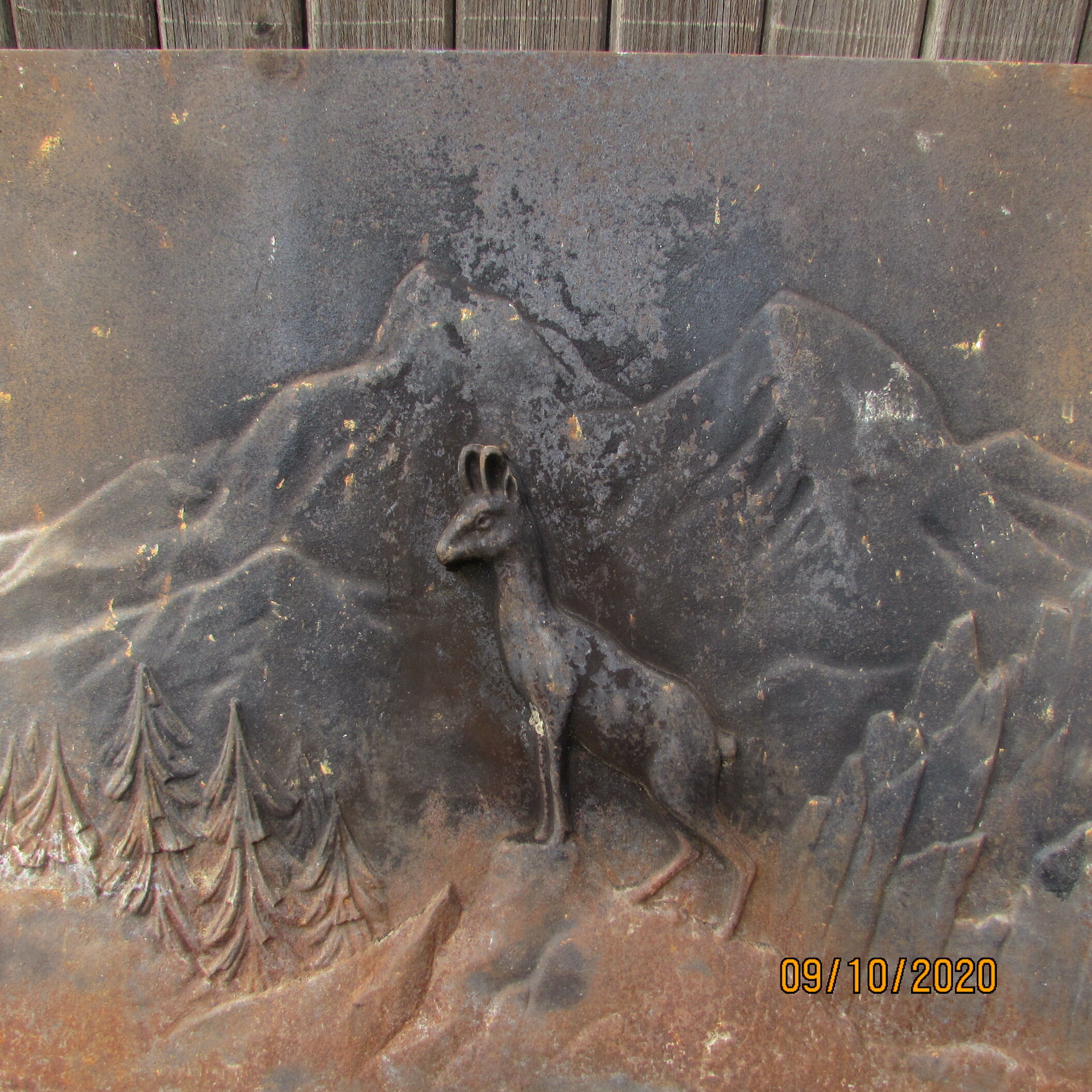 Old cast iron chimney plate