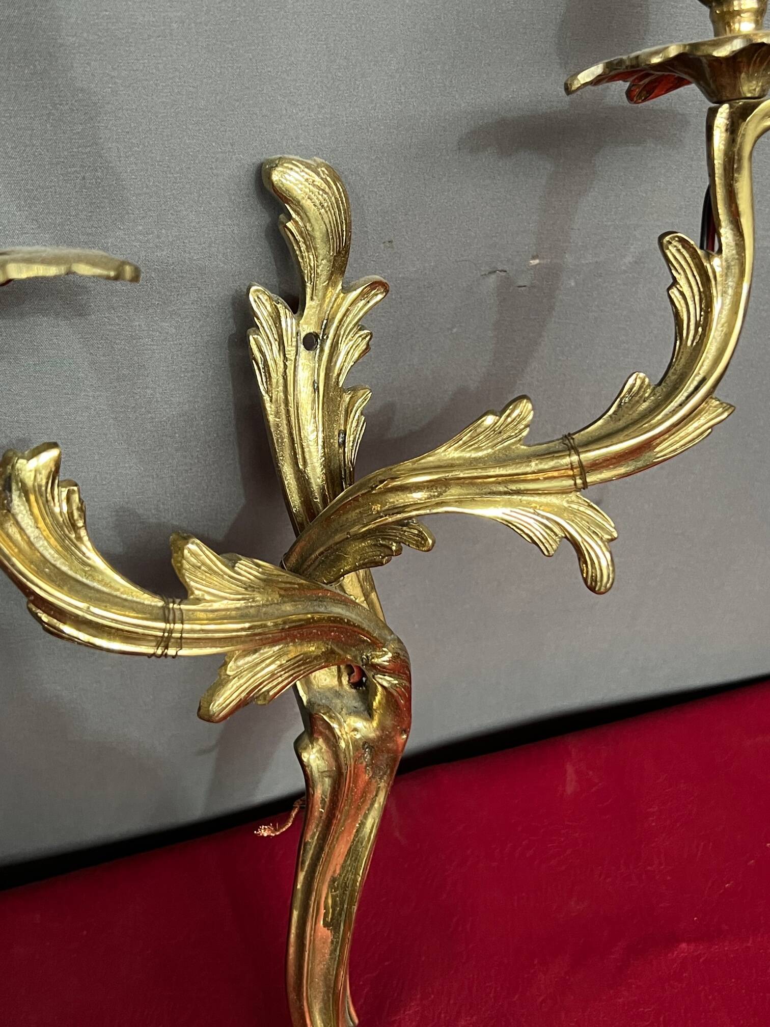 Pair of solid gilded bronze wall lights.