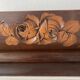 Art Deco jardinière in carved wood, decorated with roses.