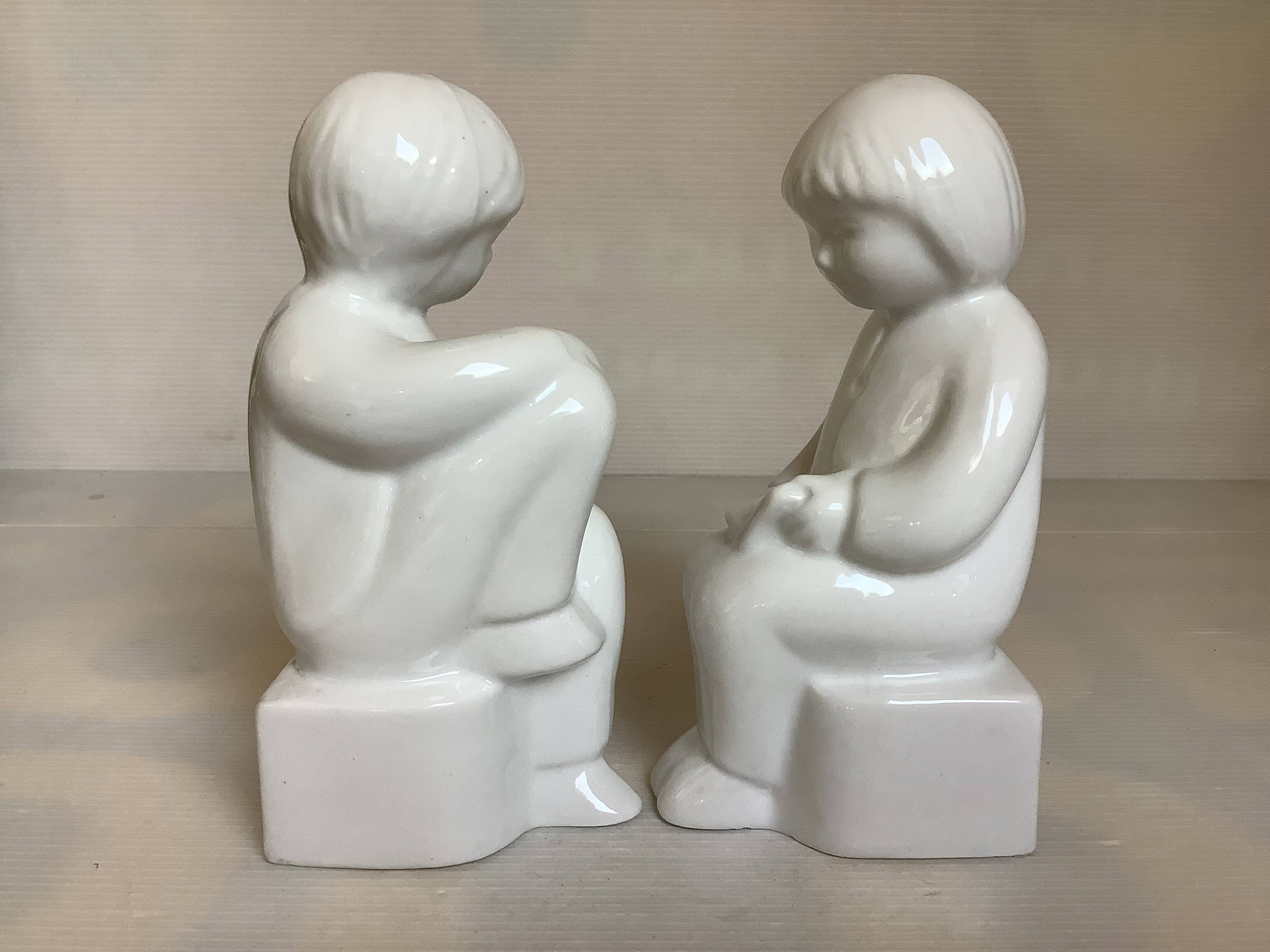 Pair of bookends featuring children reading from the 1970s.
