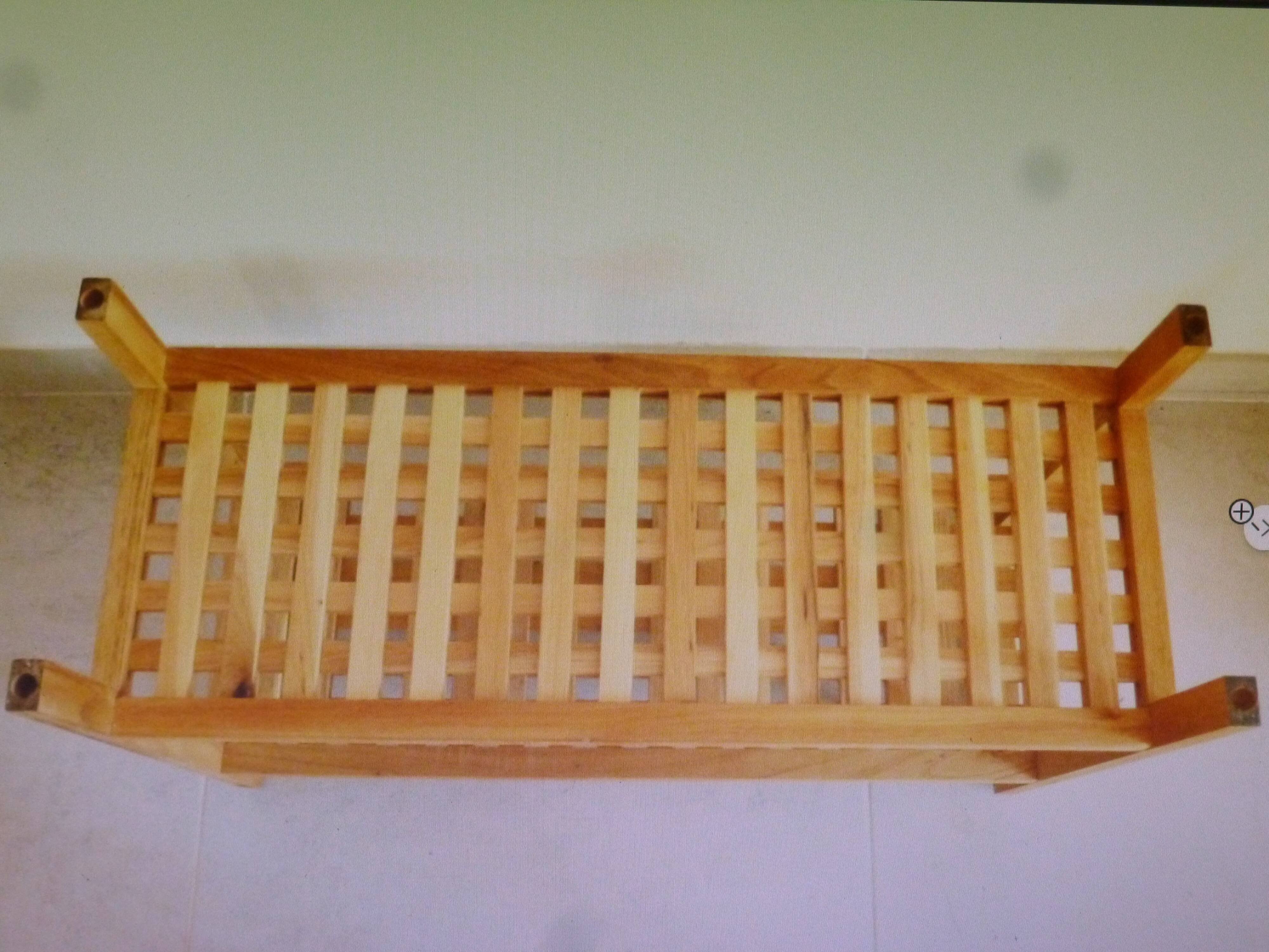 Wooden coffee table with openwork shelves and garden plant holder.