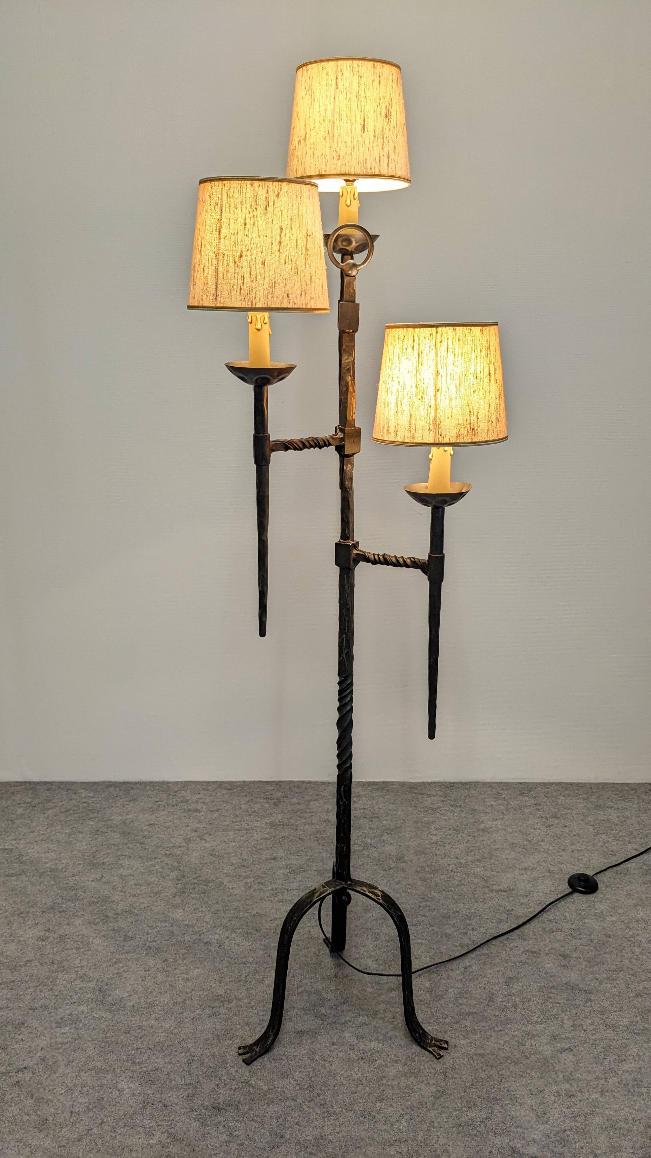 Brutalist tripod floor lamp with 3 lights in wrought iron, France circa 1950.