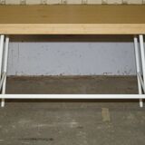 Small bamboo desk with three drawers.