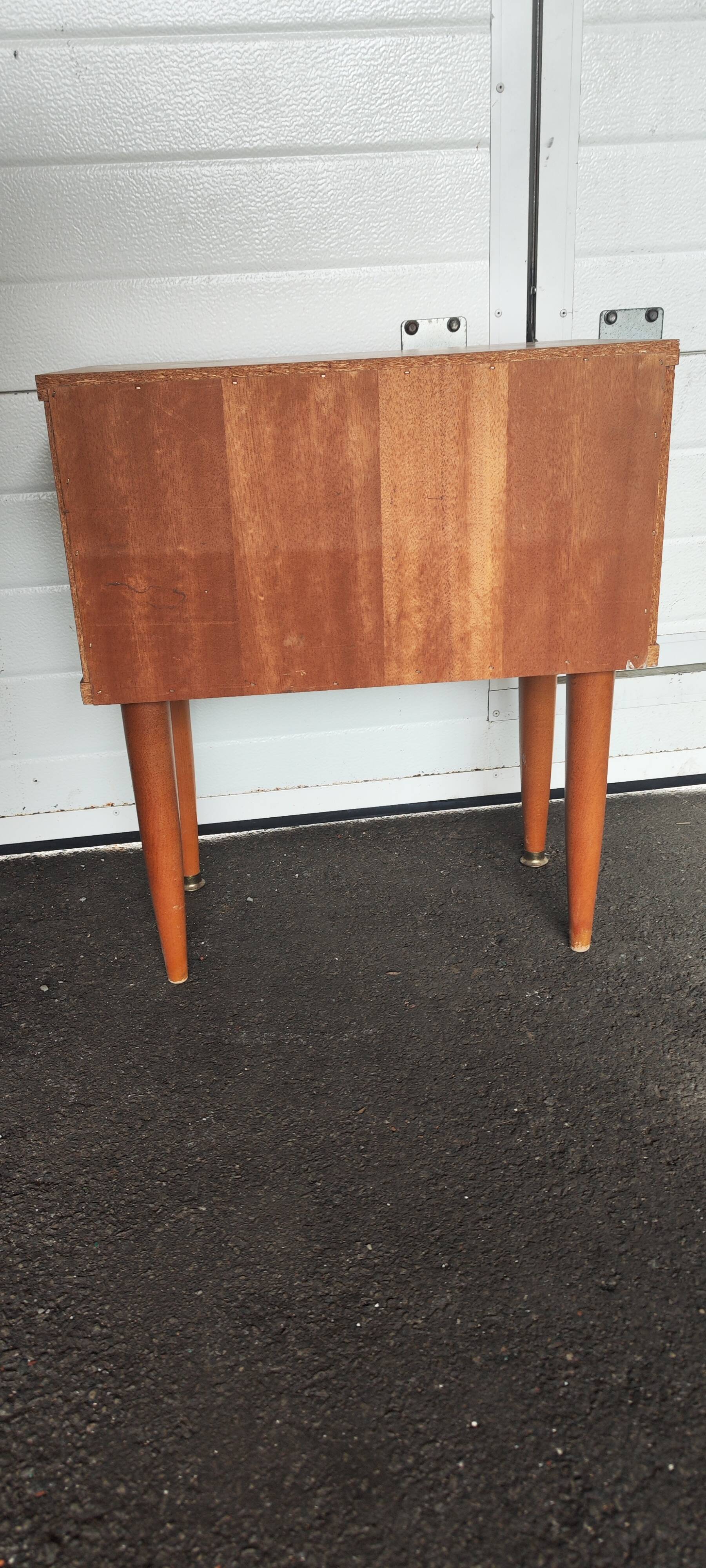 Vintage bedside table from the 70s scandinavian with a flap