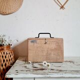 Small trunk in old wooden chest