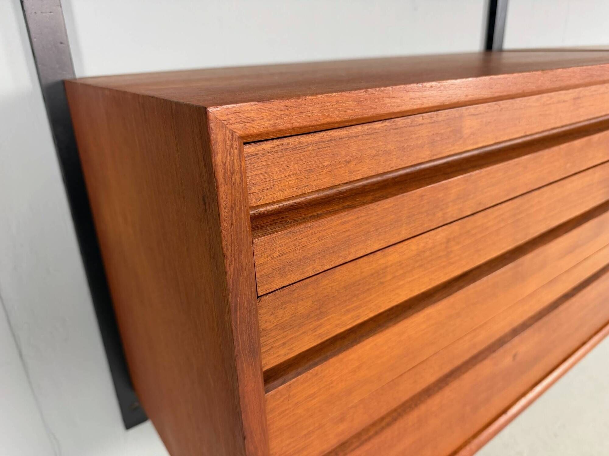 Modular wall shelf in teak in mid-century modern style, designed by Poul Cadovius for Cado, 1960.