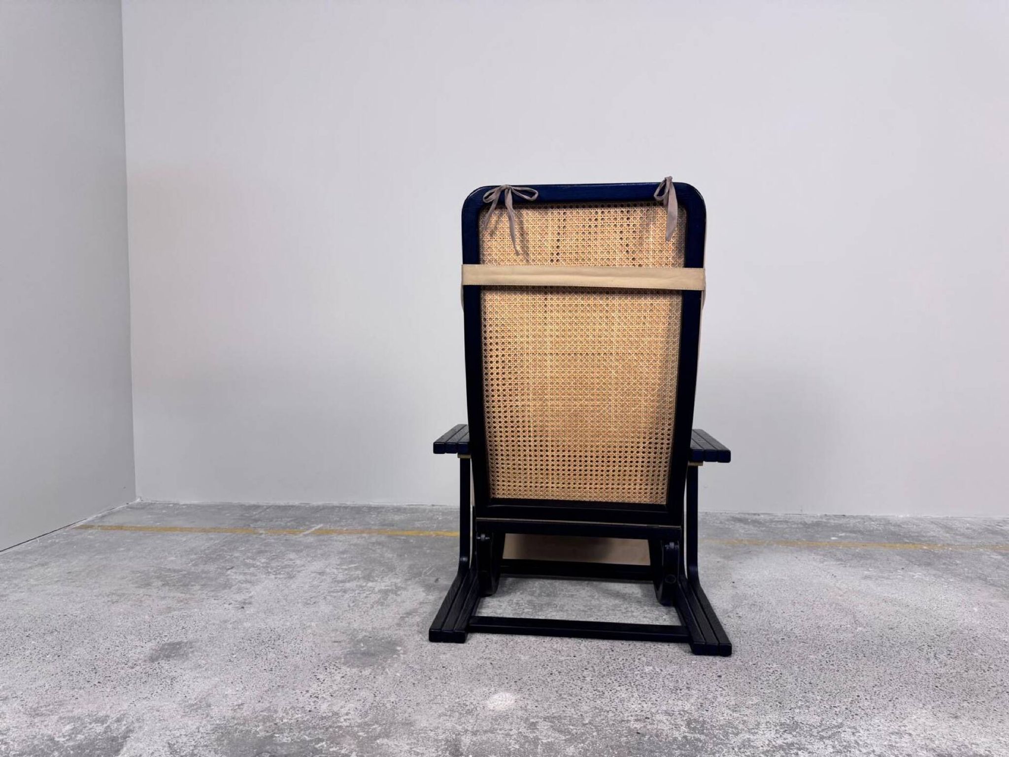 Rocking lounge chair, curved wood, leather, Viennese cane design.