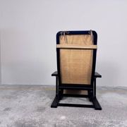 Rocking lounge chair, curved wood, leather, Viennese cane design.