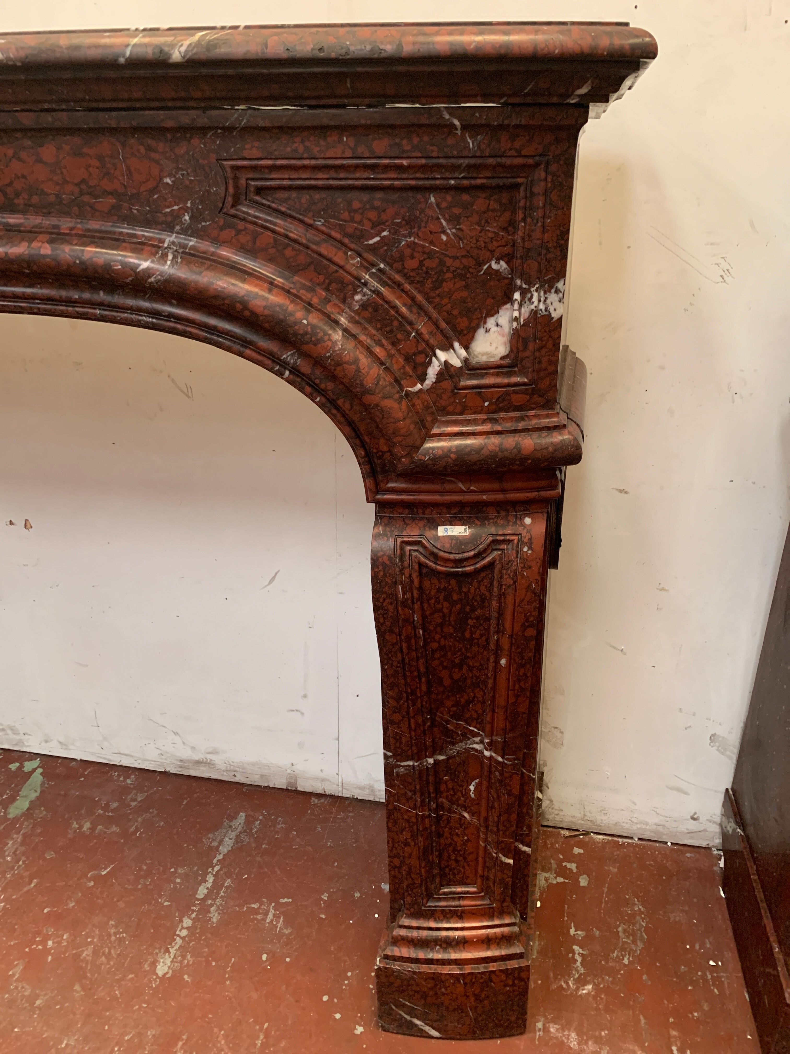 Pair of Louis XIV style fireplaces in red cherry marble. XIX century.