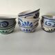 7 stoneware bowls with blue and green ocean-inspired decoration