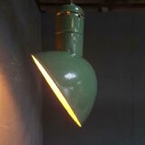 Old industrial enamel lamp in green