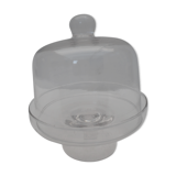 Old bell with cakes on glass stand