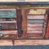 Furniture low in colorful wood. 12 drawers and 1 door