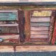 Furniture low in colorful wood. 12 drawers and 1 door