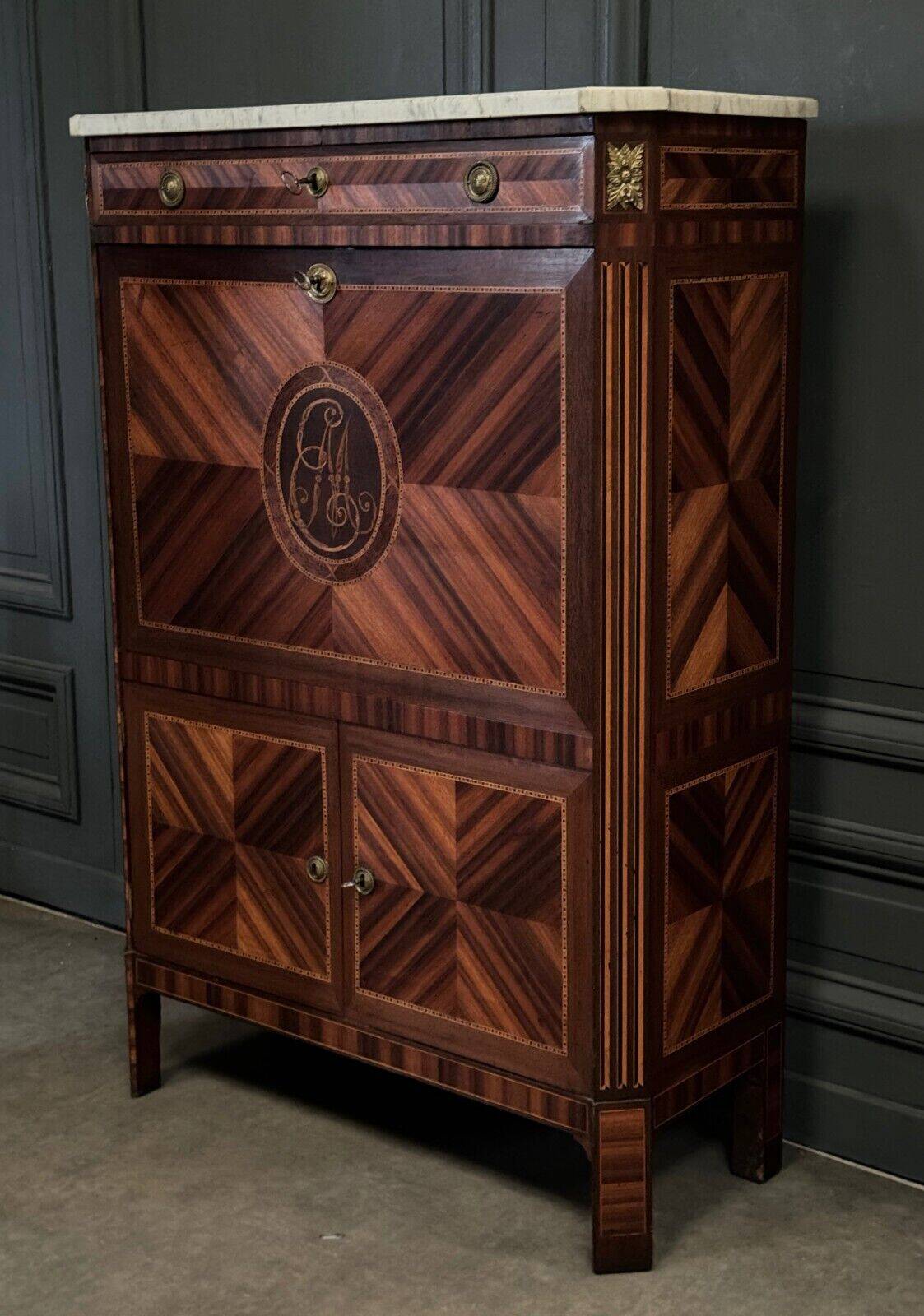 Louis XVI period secretary in monogram marquetry and white marble