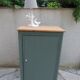 Vintage jam jar enhanced in smoky green, wooden tray.