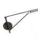 Adjustable "string" type wall light with green original shade.