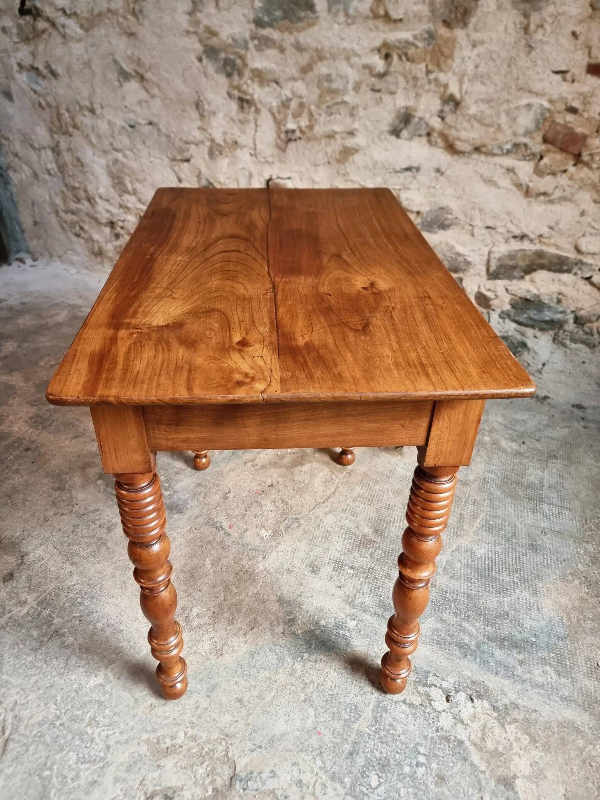 Small antique French writing table in walnut with a drawer, around 1900.