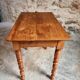 Small antique French writing table in walnut with a drawer, around 1900.