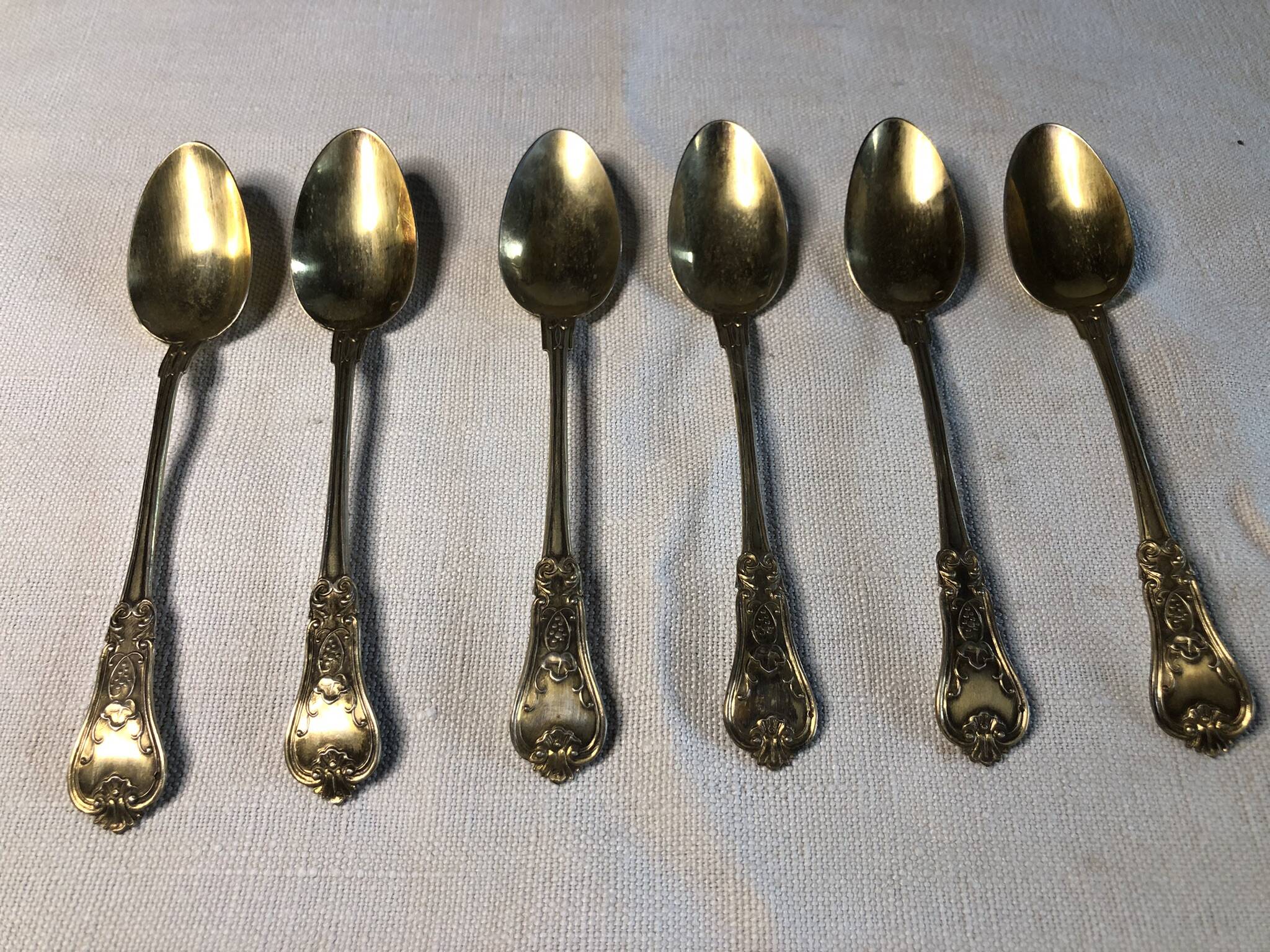 Vermeil (gilded silver) spoons in black wooden box