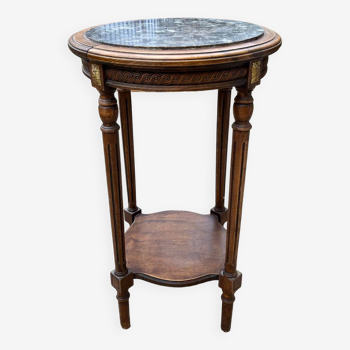 Old wooden pedestal table with marble top