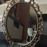 Antique oval mirror in Baroque/Rococo style. Made of gilded spelter. Dimensions: 42 x 31 cm