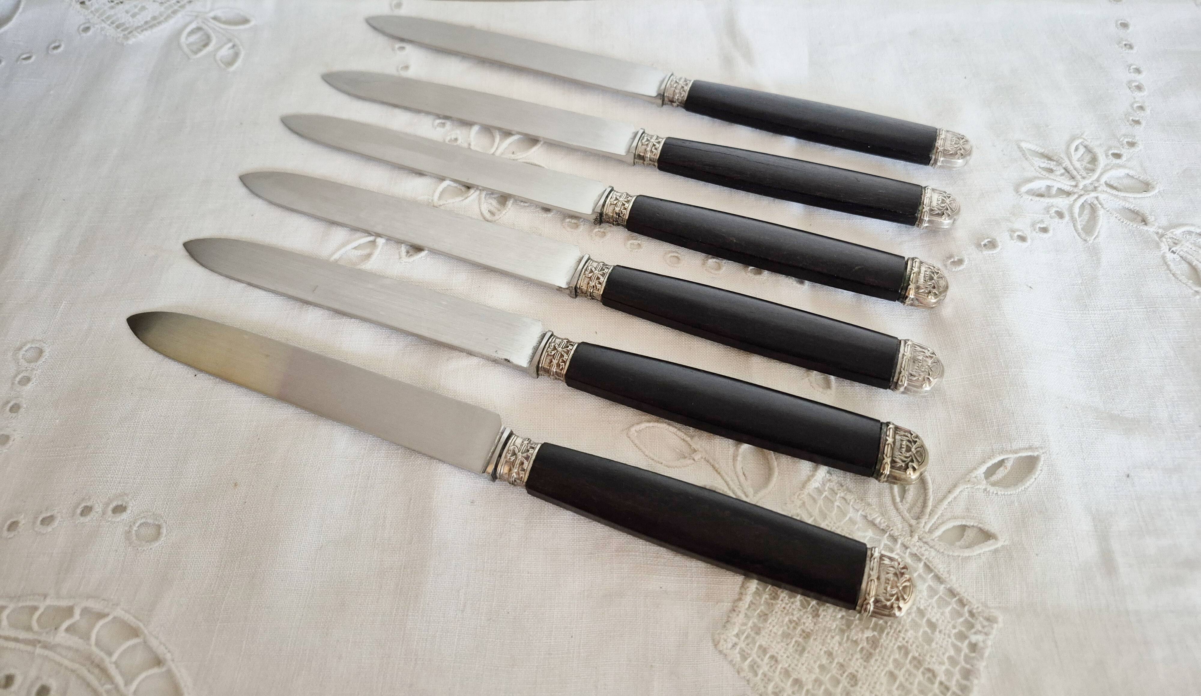 Silver and ebony cheese knives, stainless steel blade.