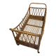 Vintage rattan baby cot on wheels.