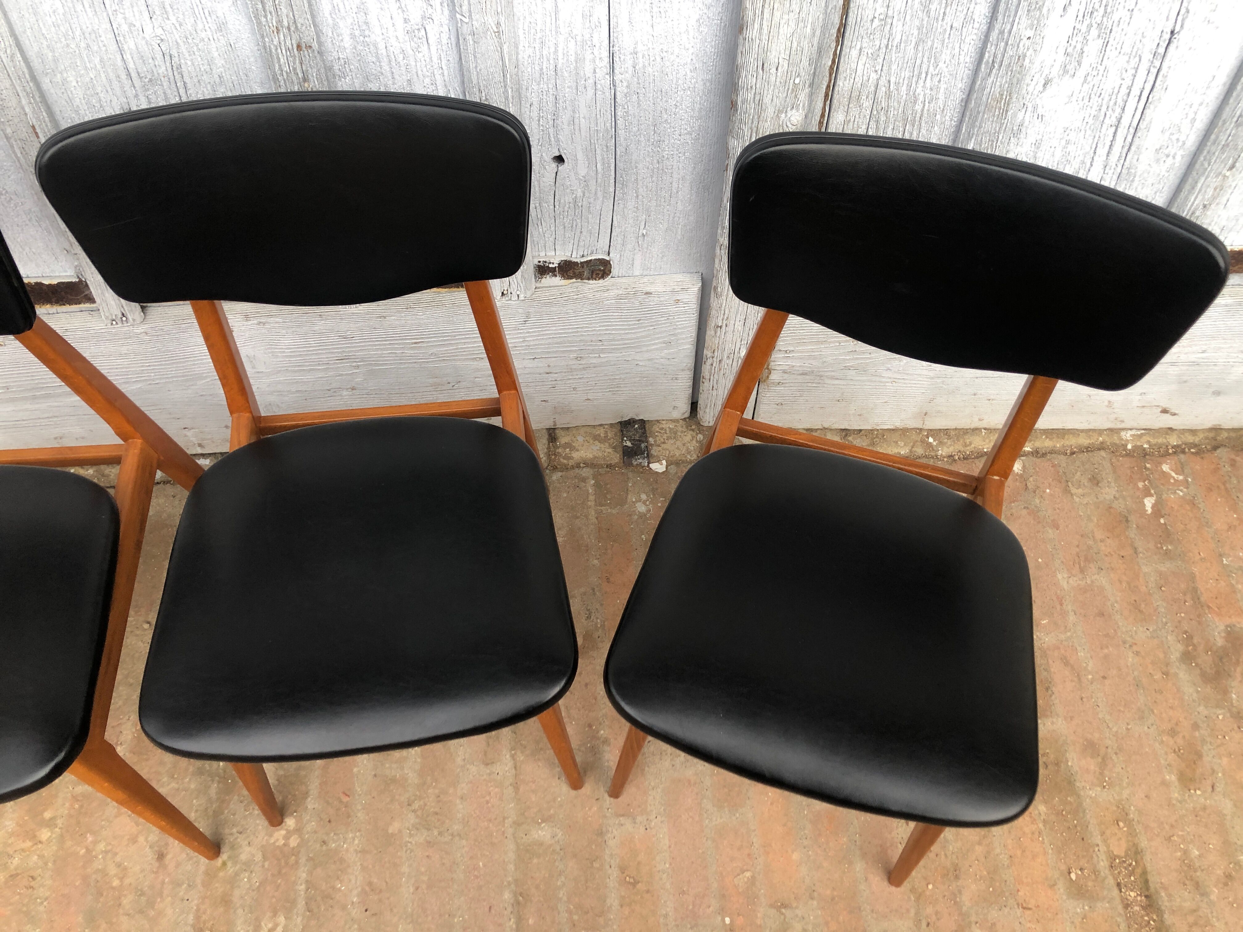 Set of 4 Scandinavian teak and black skai chairs