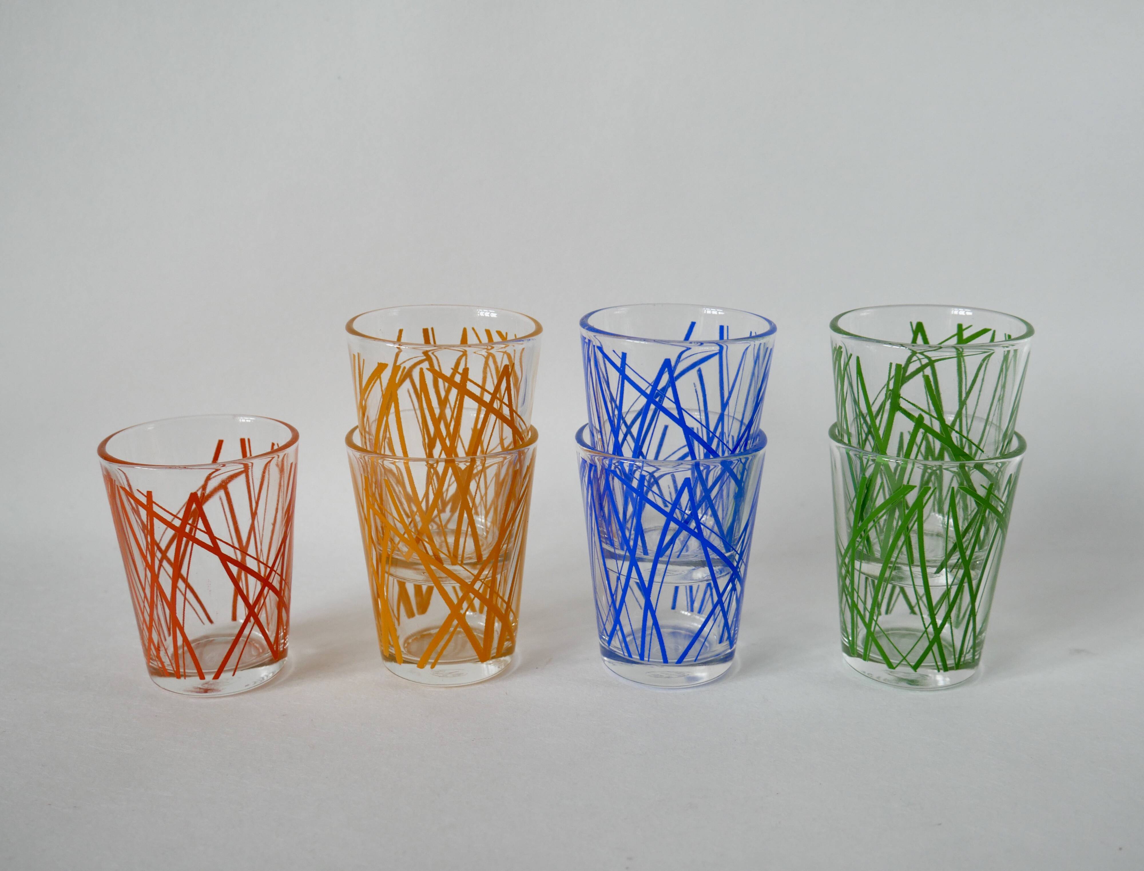 Colorful designer set composed of 7 liqueur glasses and a seventies 70s carafe