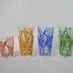 Colorful designer set composed of 7 liqueur glasses and a seventies 70s carafe