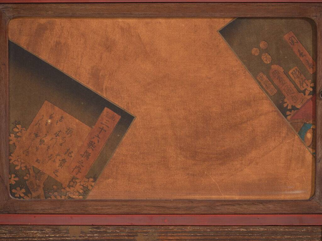 Small Japanese cabinet with sliding doors, Kabuki decoration, made of paulownia wood, early Showa period, circa 1926–1970.