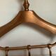 Coat rack gilded metal hanger varnished