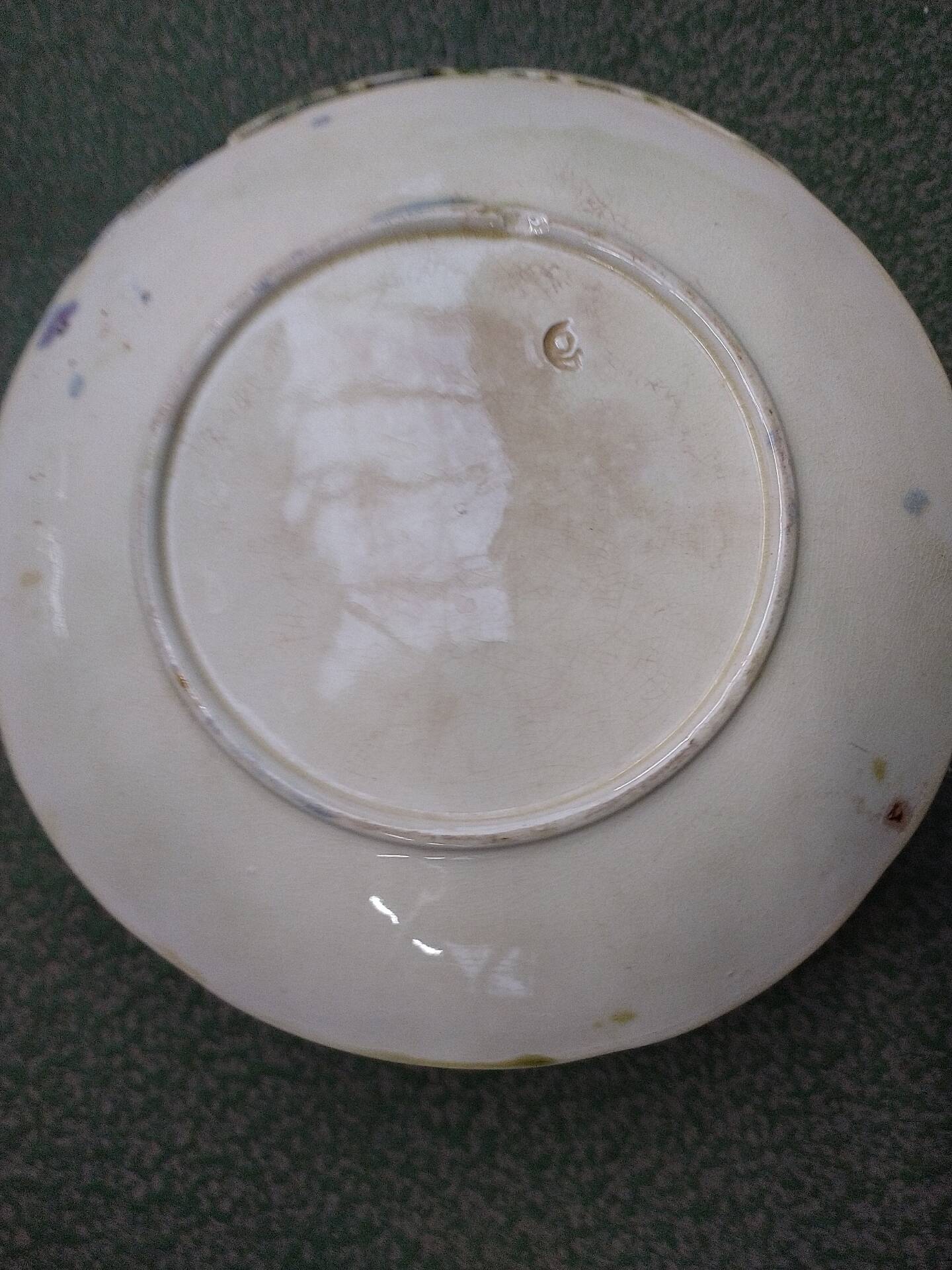 Slipware plates with vine decoration.