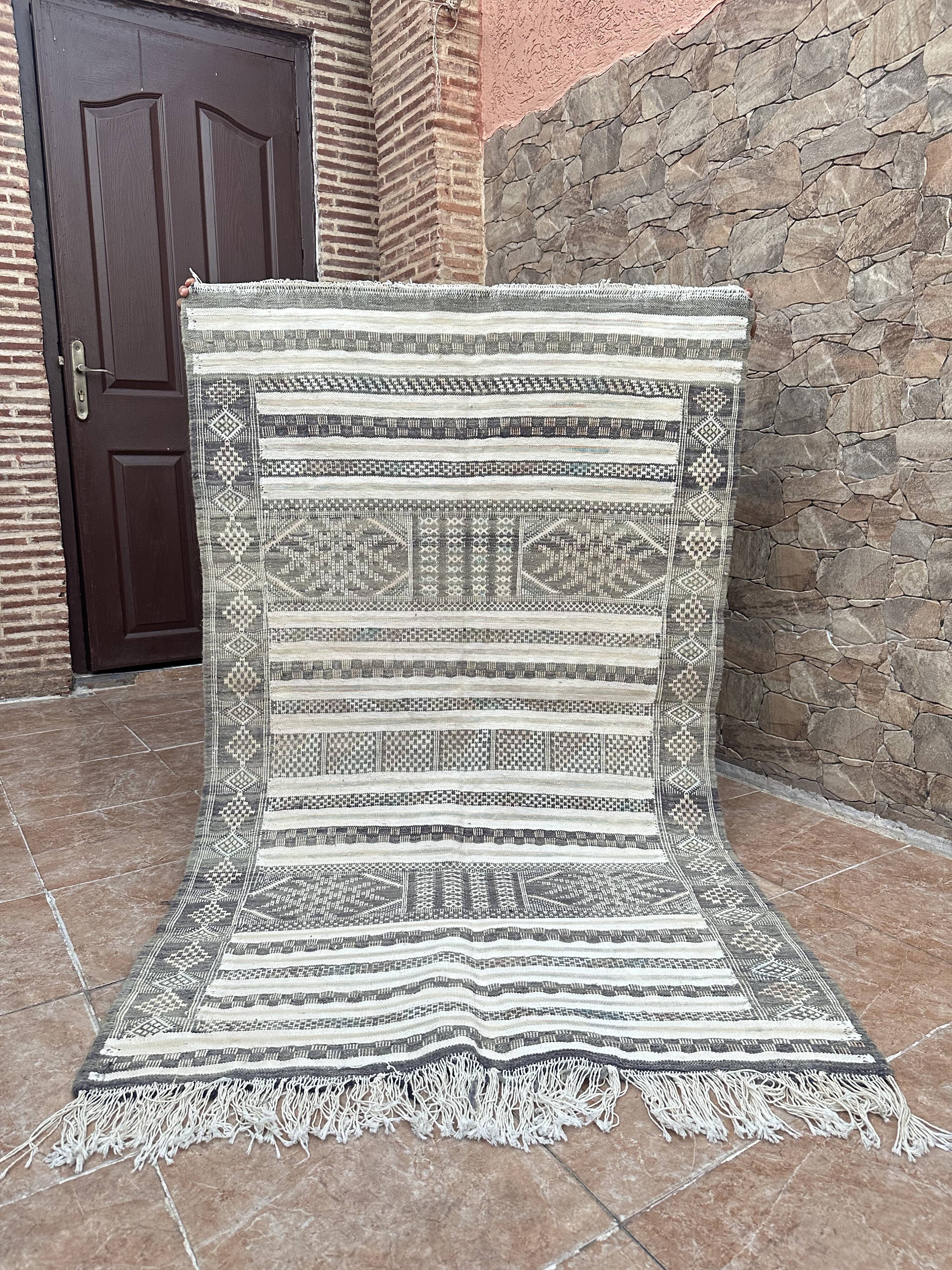 Handwoven Kilim rug made of camel wool, silk, and cactus.