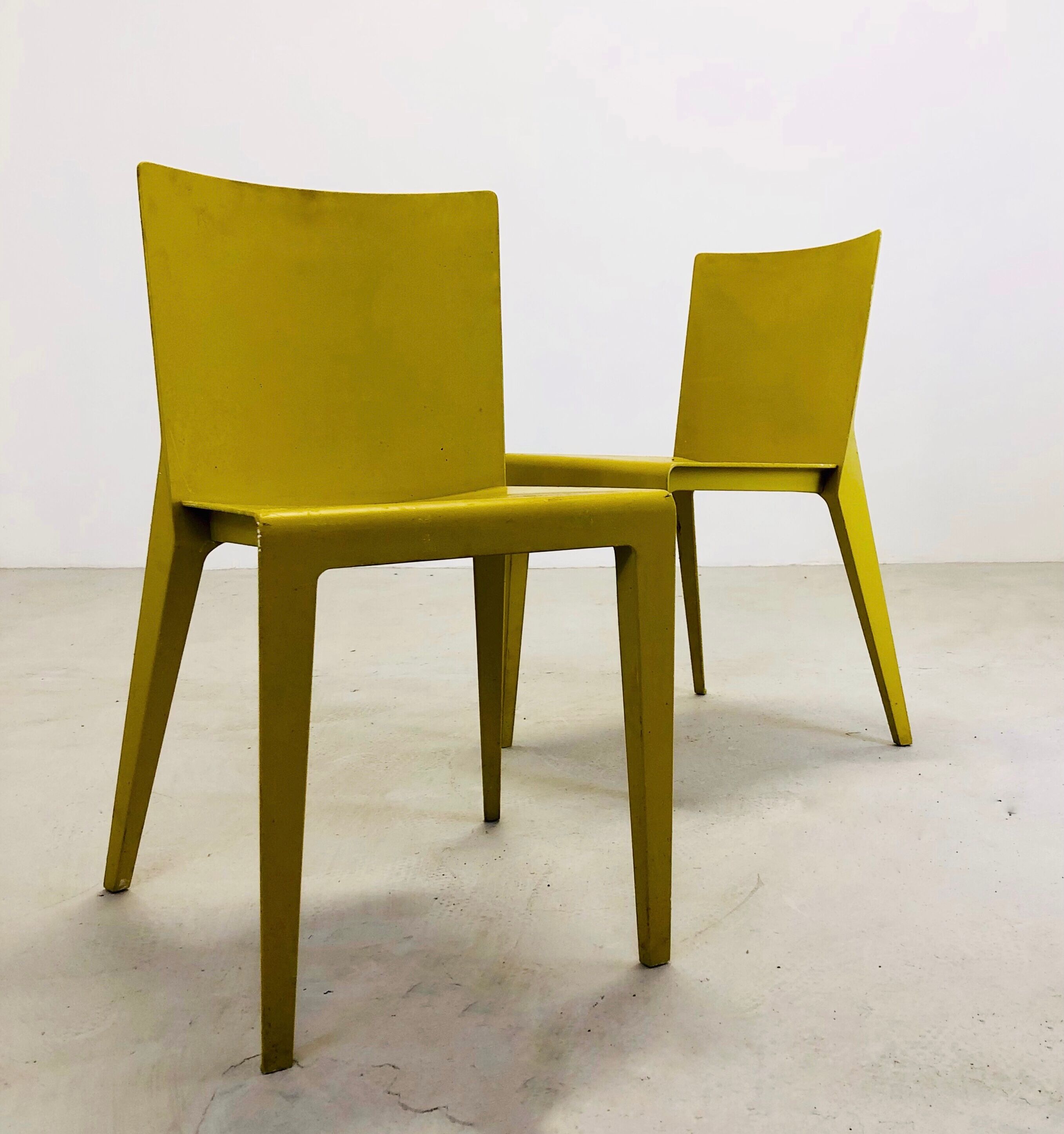 Two yellow "Alfa" chairs by Hannes Wettstein for Molteni