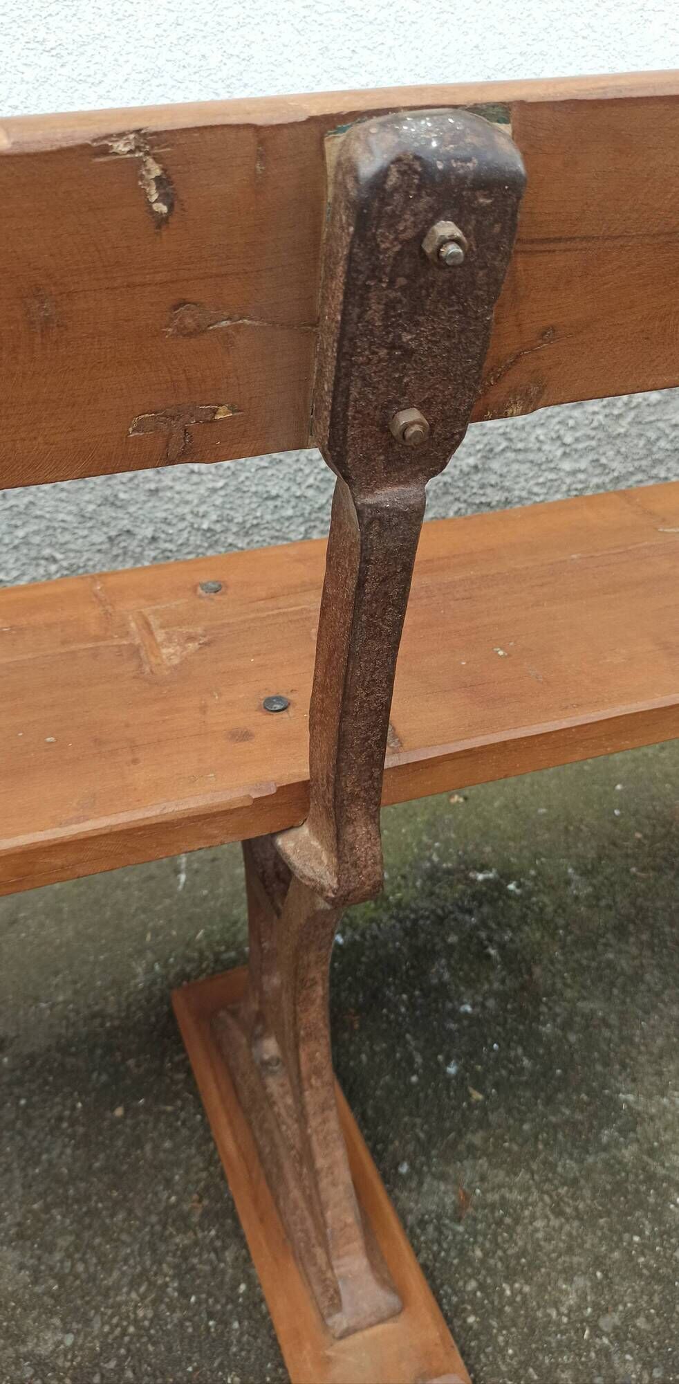 Old wooden bench with cast iron base