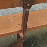 Old wooden bench with cast iron base