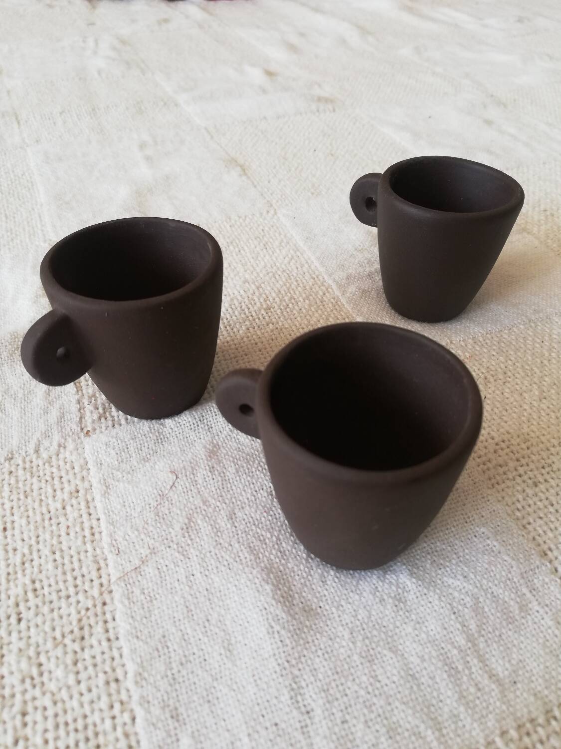 Set of three matte brown ceramic cups for dolls' play kitchen