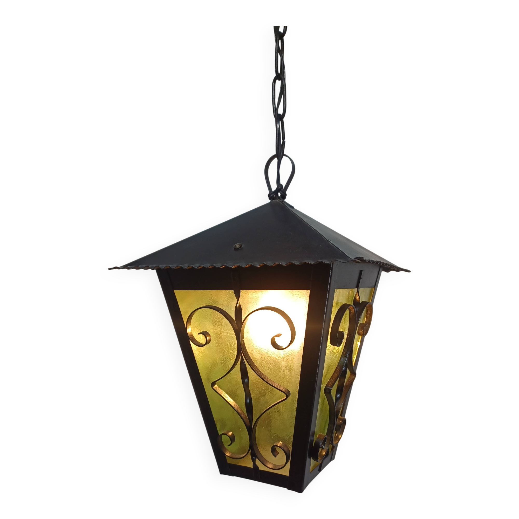 Wrought iron and green glass lantern