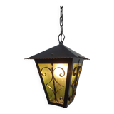 Wrought iron and green glass lantern