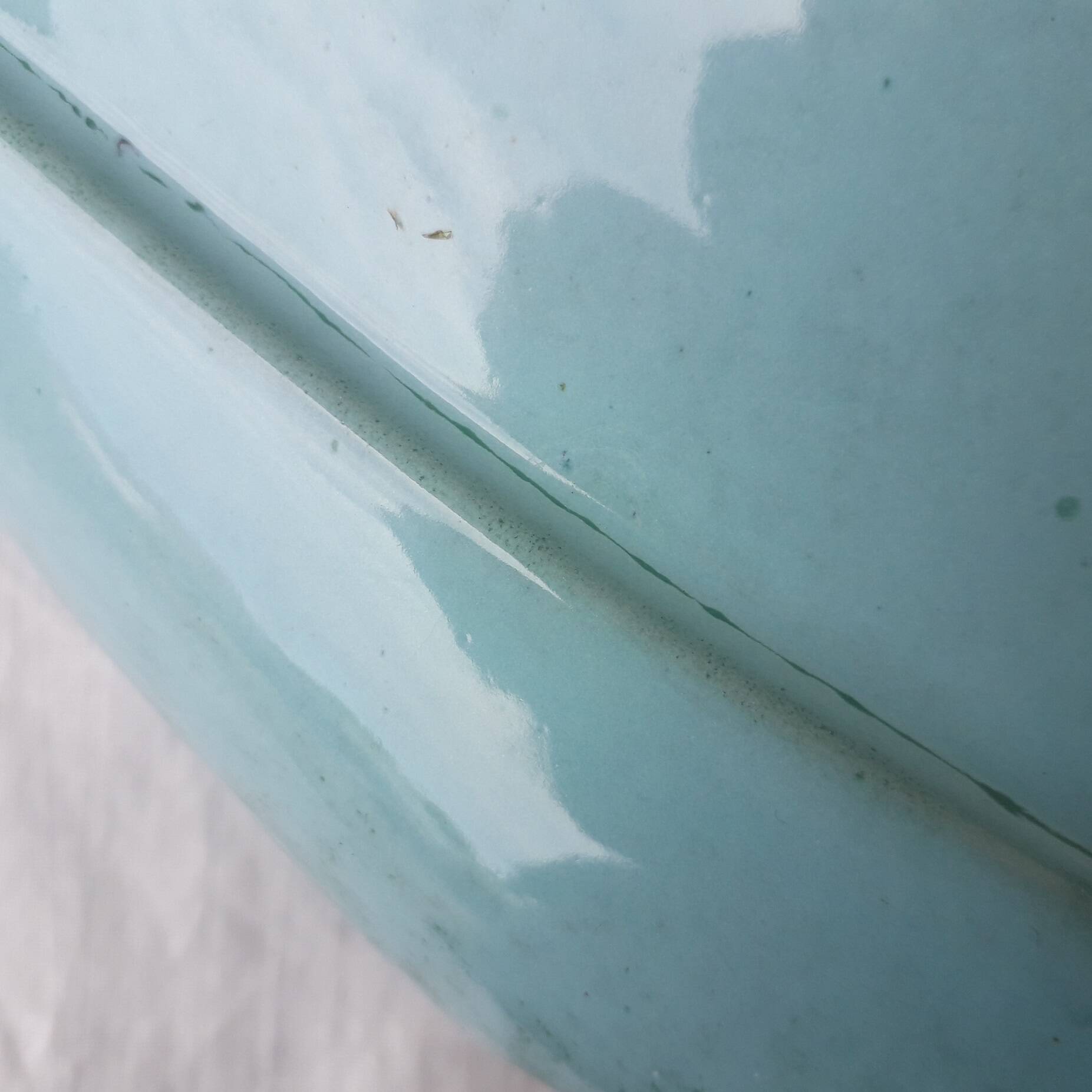 Triangular ceramic vase