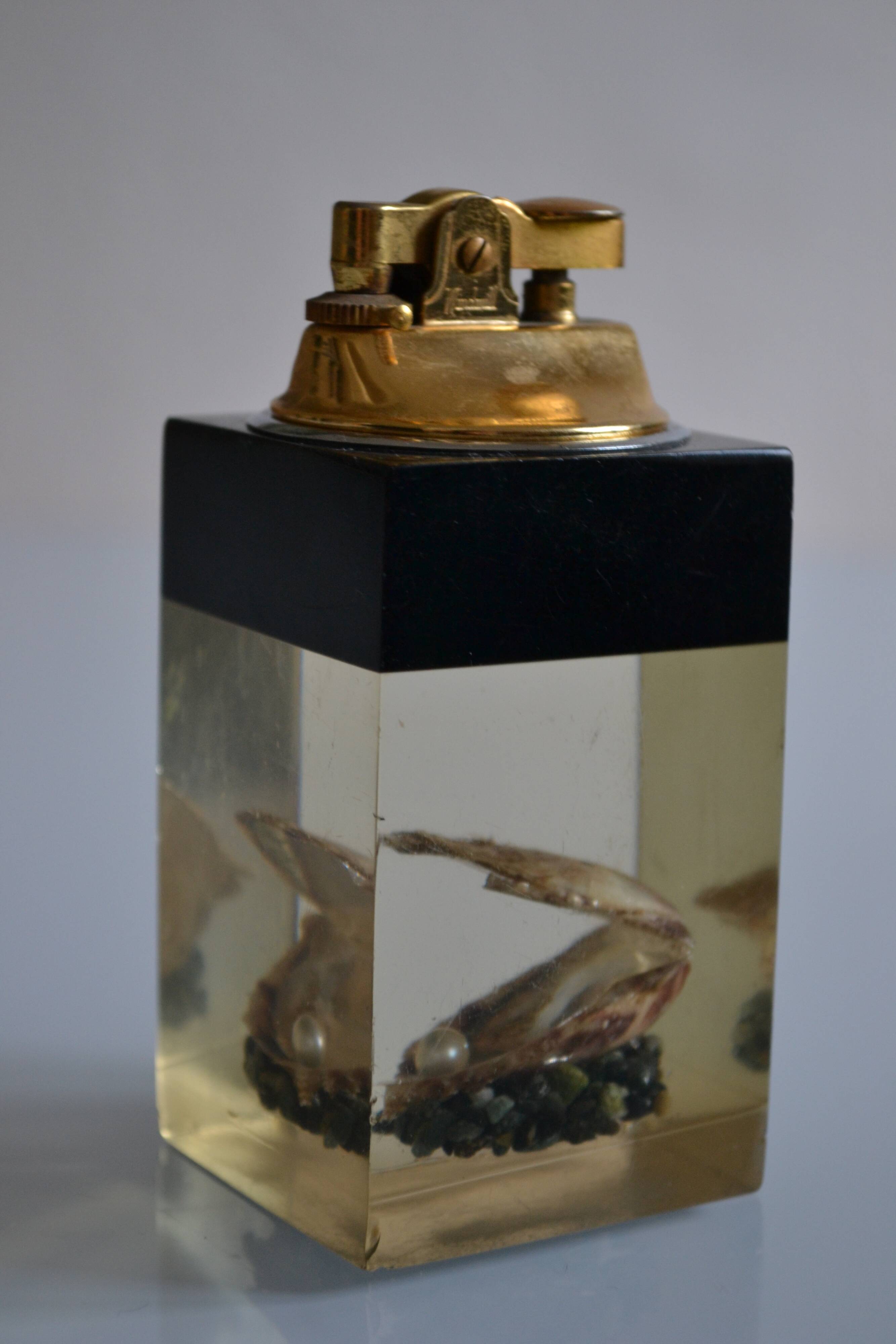 1970 Table lighter with pearl oyster in resin inclusion