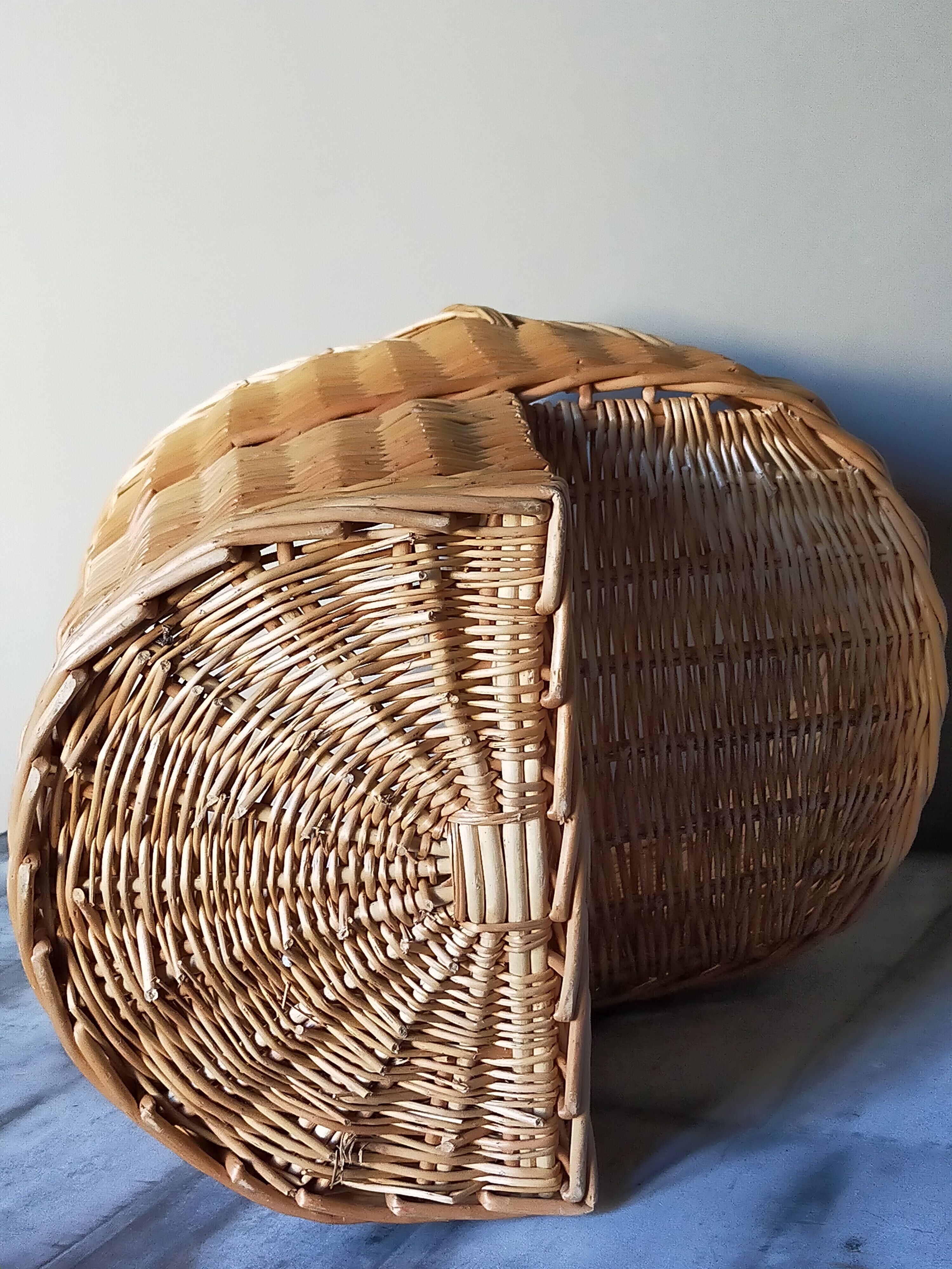 Asymmetrical woven rattan basket