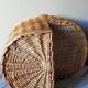 Asymmetrical woven rattan basket