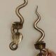 Pair of Egyptian Revival Style Engraved Brass Cobra Sconces