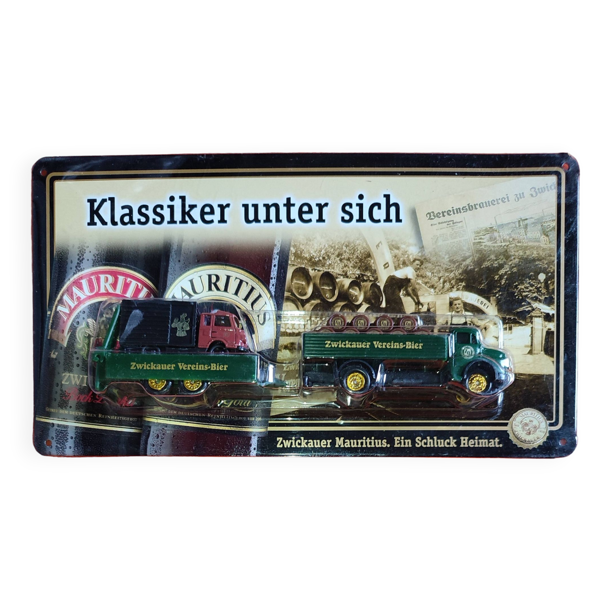 Mercedes flatbed containing drums pulling 1 trailer carrying 1 covered vehicle