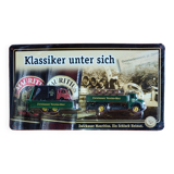 Mercedes flatbed containing drums pulling 1 trailer carrying 1 covered vehicle